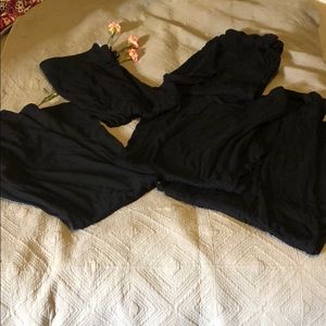 Lot of black pajama pants.